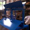 Macchina automatica atta alla selezione e ricalibratura di componenti per stendibiancheria verticale